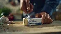 Cutting a block of butter